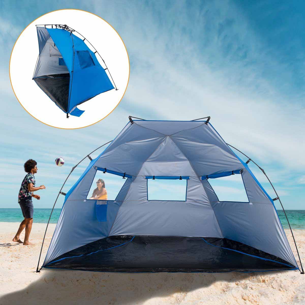 A couple is playing voleyball near the 4 Person Large Easy Up Beach Tent Sun Shade Shelter UPF 50+ with three windows open