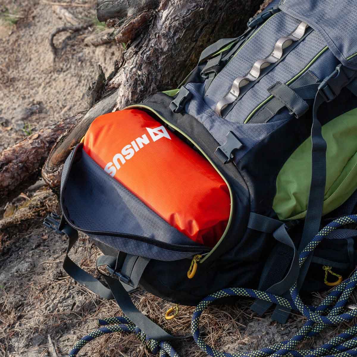 10 L Orange Polyester Waterproof Dry Bag for Fishing, Kayaking packed into the TRAVEL backpack
