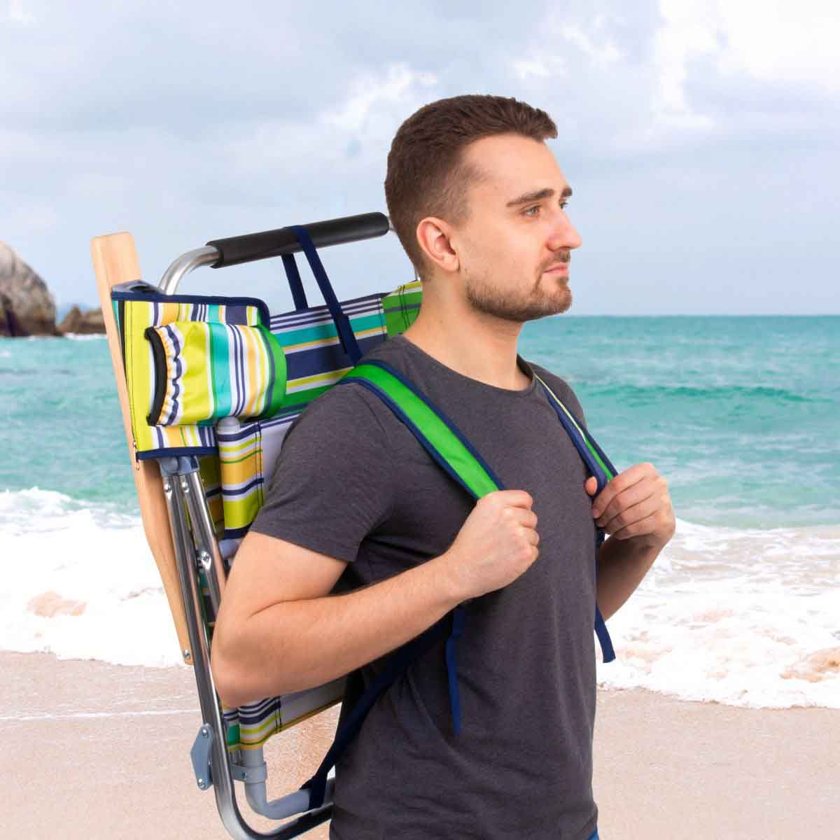 A man holding Backpack Beach Chair with Headrest on the back