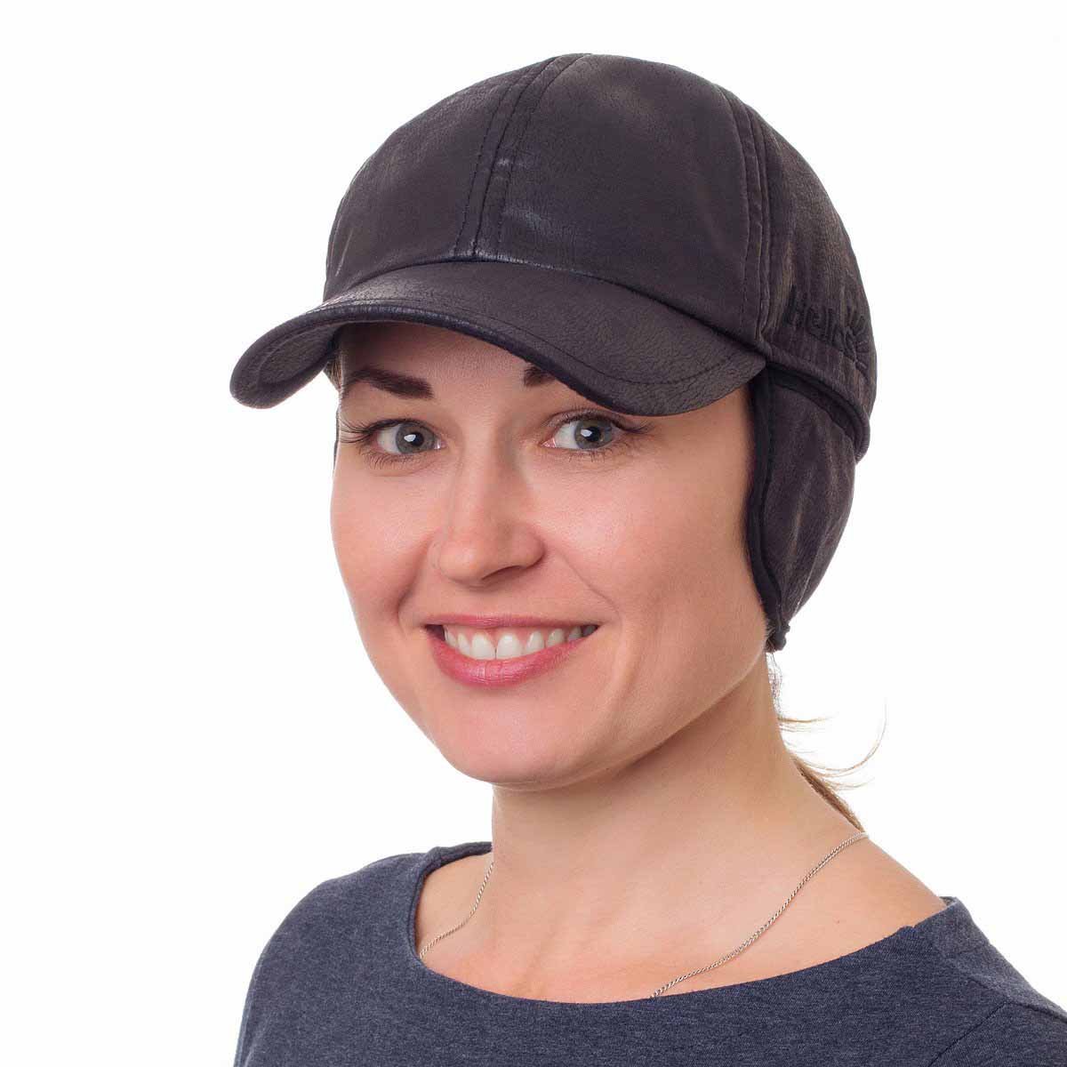 A woman wearing Ataka Winter Trapper Hat Ball Cap with Ear Flaps