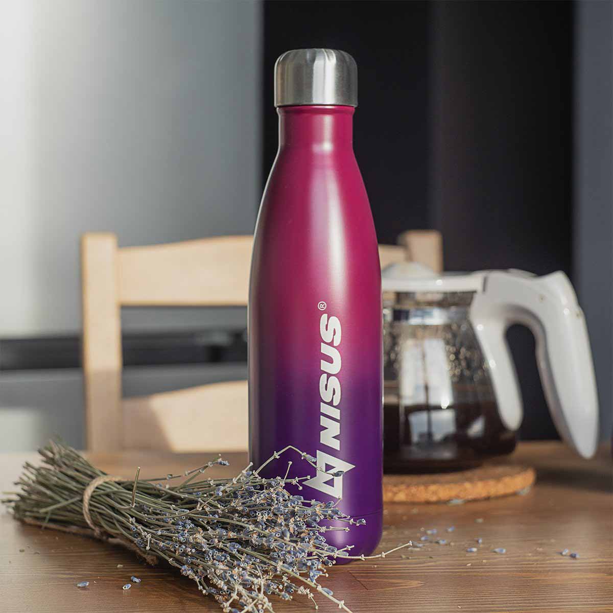 Stainless Steel Twist Top Water Bottle, Double Colored, 17 oz, Reb and Dark Blue standing on the kitchen table